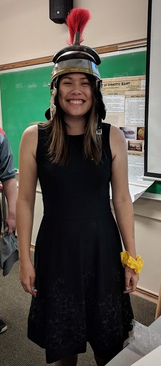 Sharon Kuhlemier '20 tries on a reproduction of a Roman helmet.